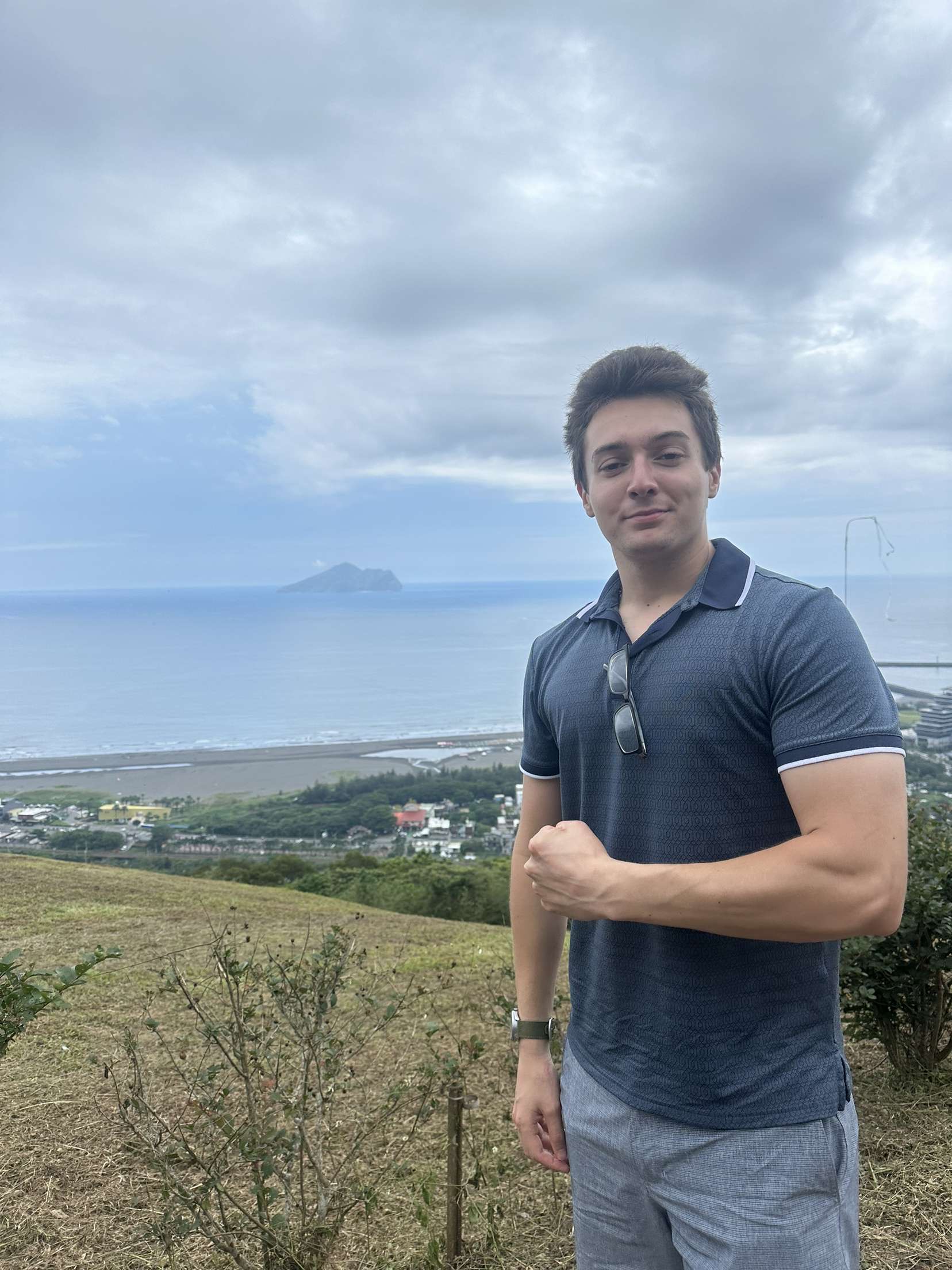 David Hamilton with the Taiwanese countryside behind him.
