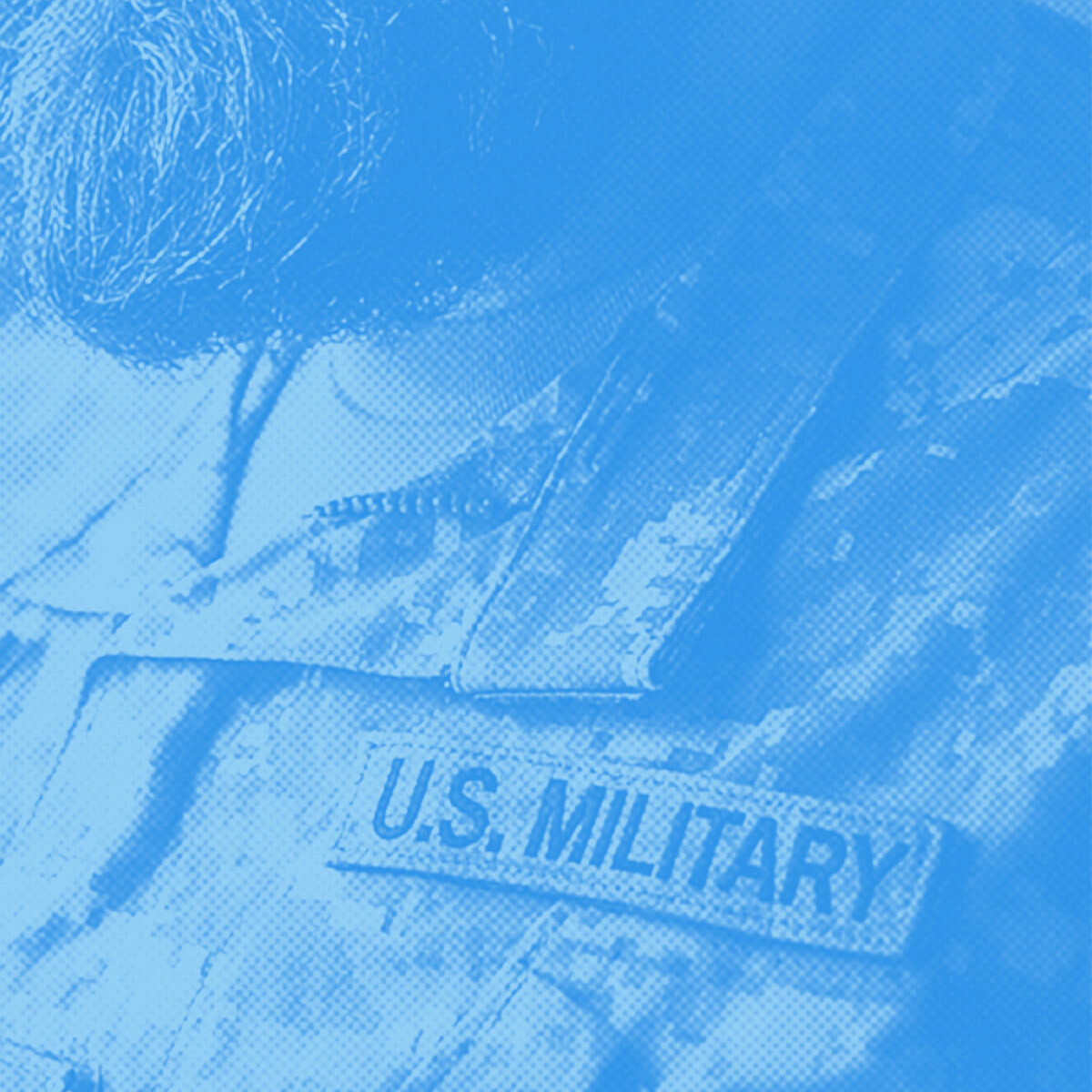 Blue-toned close-up of a uniform with a U.S. MILITARY name tape.