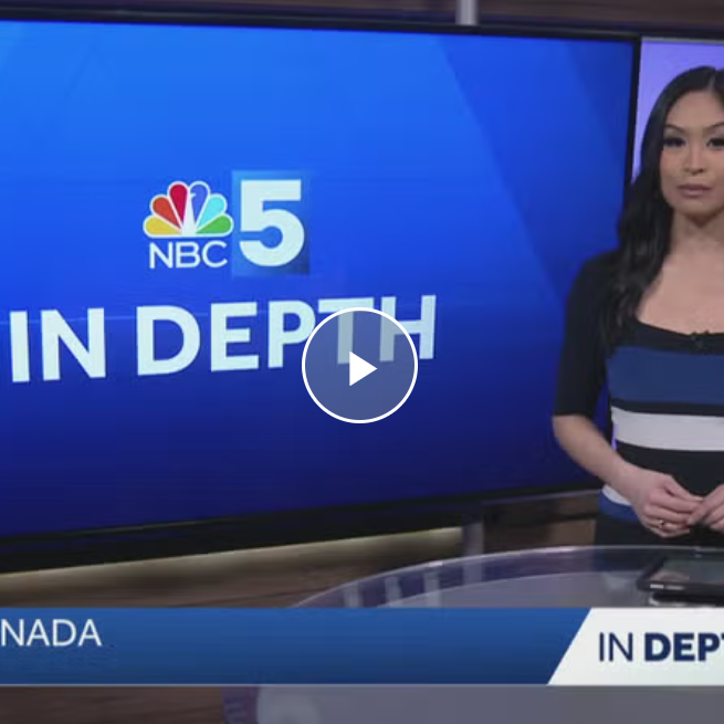 TV news anchor stands beside an NBC5 In Depth screen in a studio.