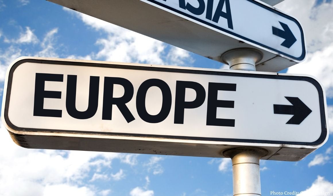 Street sign that says "Europe" with an arrow pointing to the right.