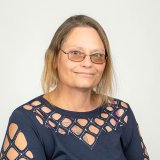 Christy Boarman in blue shirt with glasses