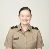 Cadet in uniform faces the camera against a plain background.