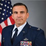 Col Foisy in uniform with American Flag