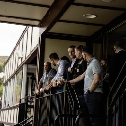 A group of military, Norwich, and NATO officials enjoy a football game from the President's Box.