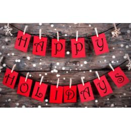 "happy holidays" cards on clothesline affixed with clothespins