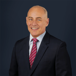 GEN John F. Kelly retired four-star U.S. Marine Corps general - dark suit, professional headshot