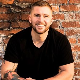 Adam Jones Captain and Black Hawk Pilot U.S. Army, casual portrait photo smiling  