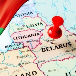 Map of Belarus and surrounding countries with red push pin on Belarus.