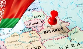 Map of Belarus and surrounding countries with red push pin on Belarus.