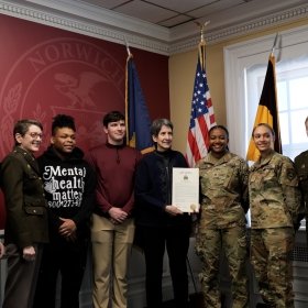 Representative Anne Donahue (Northfield), Provost & Dean of the Faculty, and Acting President Dr. Karen Gaines, 56th Commandant of Cadets and Vice President of Student Affairs Bill McCollough ’91, William Kolb, Imari Milton, Cadet Kimeisha Moyston, and Cadet Leslie Malin