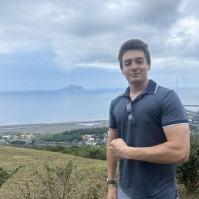 David Hamilton with the Taiwanese countryside behind him.