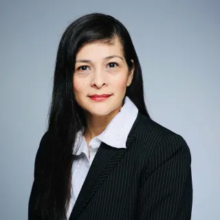 Woman in Business Suite with long dark hair
