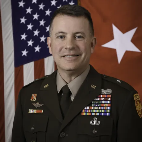 Professional photo of United States Army Brigadier General Shane P. Morgan in uniform standing in front of a United States flag.