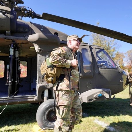 BG Adam Cobb steps off of a Black Hawk Helicopter.