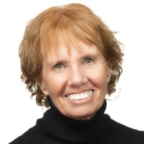 Professional headshot of a smiling woman.
