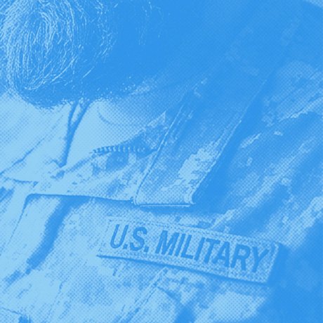 Blue-toned close-up of a uniform with a U.S. MILITARY name tape.