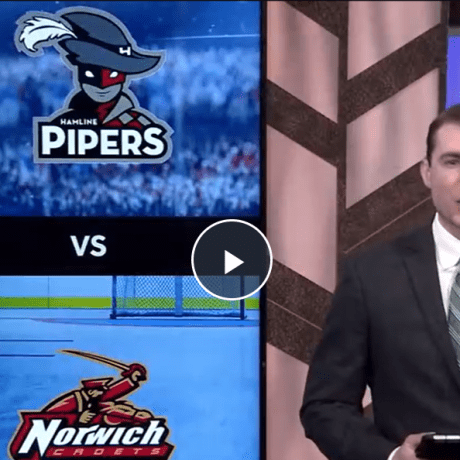 TV anchor stands beside a screen showing Hamline Pipers vs Norwich Cadets hockey matchup.