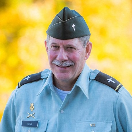 Rev William Wick in uniform smiling