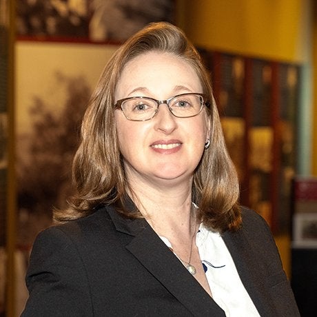 Stephanie Skenyon in black suitcoat with glasses