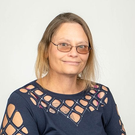 Christy Boarman in blue shirt with glasses