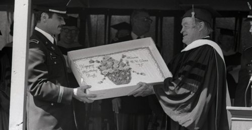 Bob Hope with a birthday cake given to him by the Norwich University Class of 1975 during their commencement exercises in Northfield, Vermont, in May 1975.