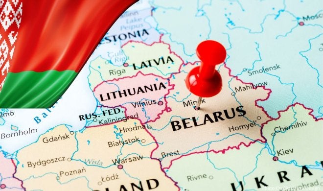 Map of Belarus and surrounding countries with red push pin on Belarus.