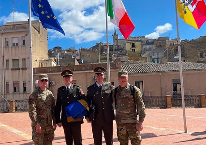 Cadet Wineriter and Cadet Darby standing with two of the Ukrainian Cadets in the Piazza Armenia. 