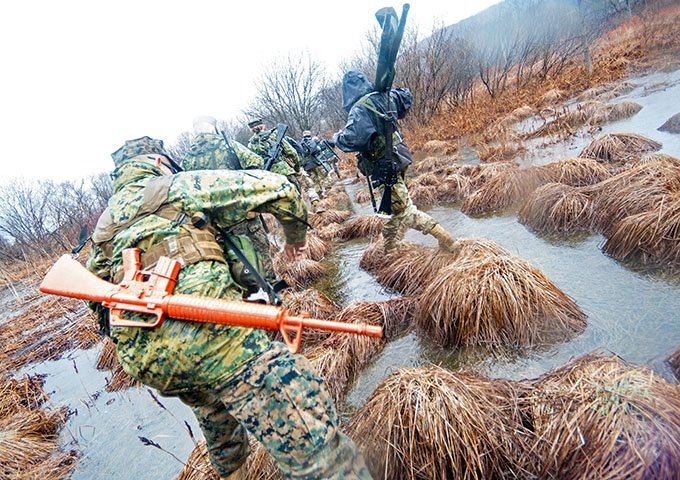 USMC FTX Norwich Cadets Walking In Gear Through Marsh