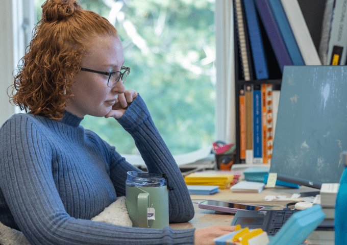 Norwich architecture student working at a desk in Chaplin Hall.