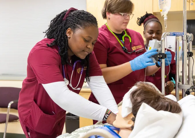 Norwich Nursing majors caring for a simulation patient in our state-of-the-art facility.