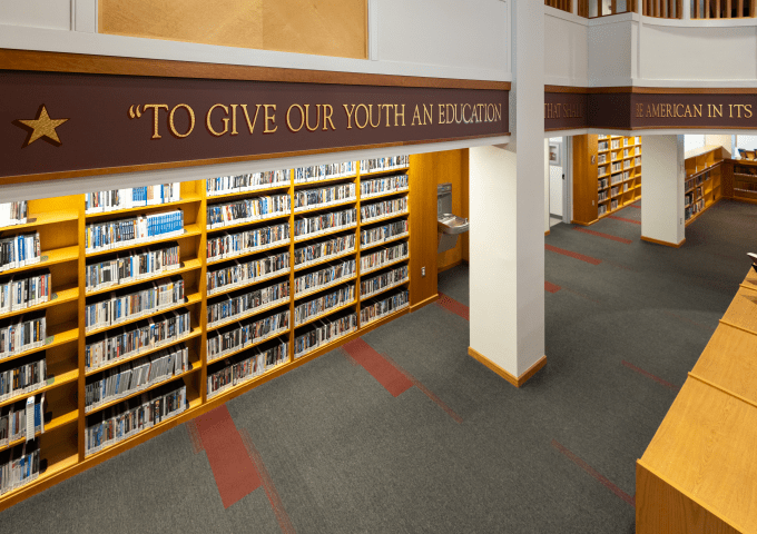 Kreitzberg Library main floor lined with bookshelves at Norwich University.