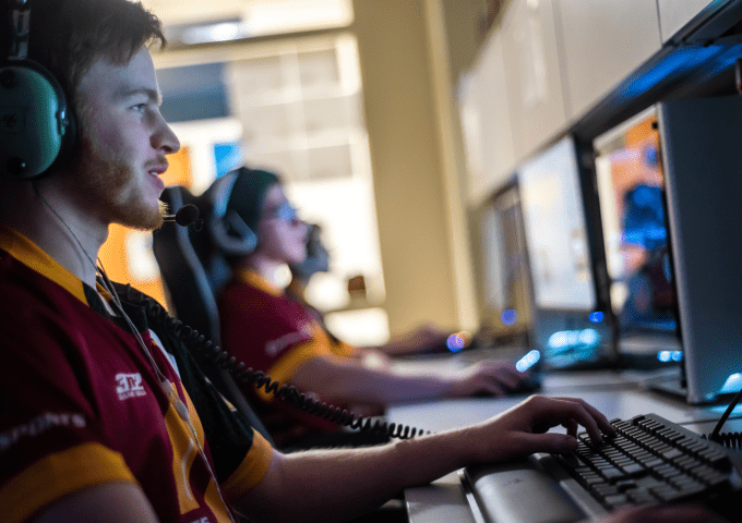 Esports students gaming on computers. 