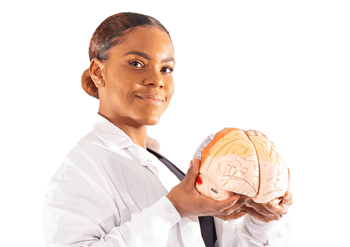 Shawnae T. Evans '21, holding brain in lab coat.