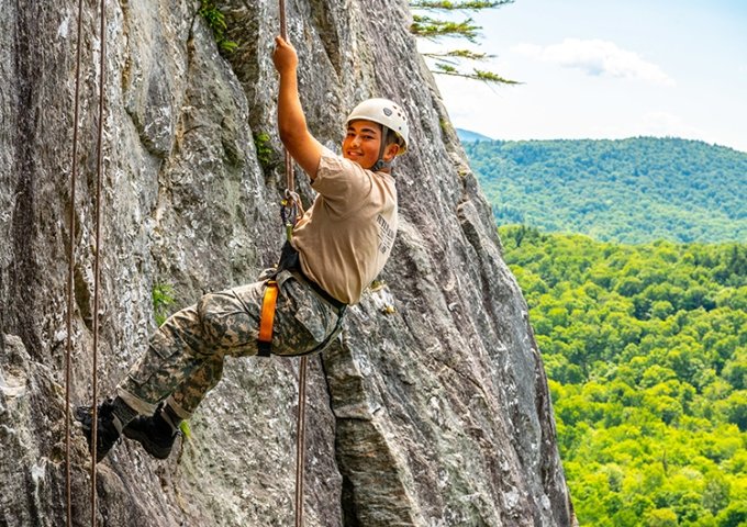 FLC camper repelling in the Green Mountains.