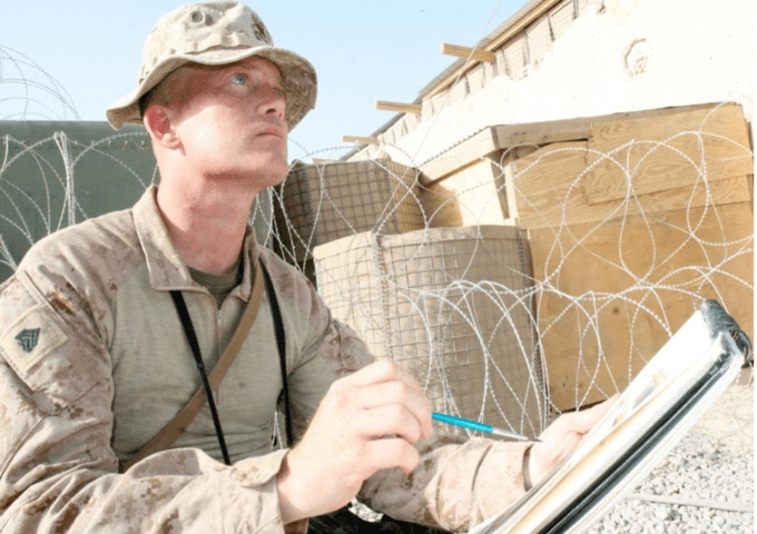 Artist creating a sketch during deployment