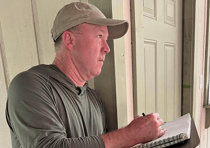 Male artist with sketchbook