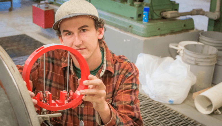 Civil Engineering major shows his senior research project at Norwich University.