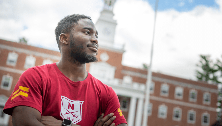 Student in front of Jackman Hall.