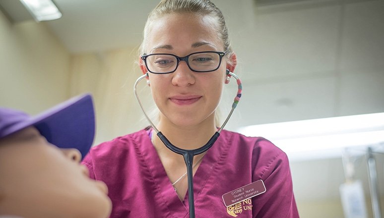 Norwich nursing Student working with sim lab patient