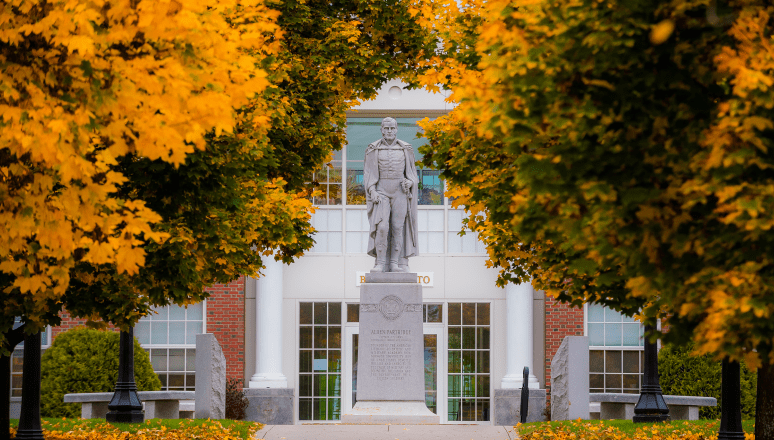 Capt. Alden Partridge statue surrounded by golden fall foliage.