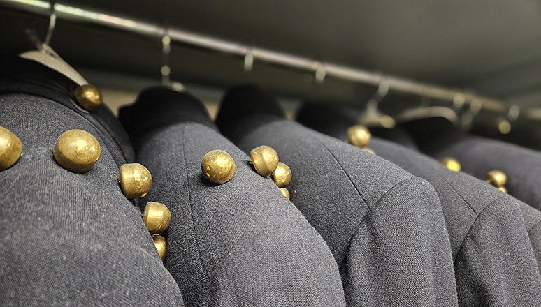 Sullivan Museem Collection Uniforms hanging in storage