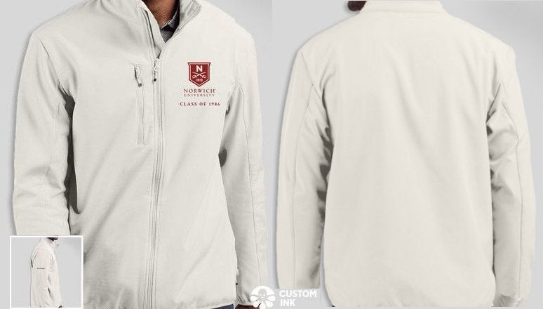 Fog colored soft shell jacket with Norwich shield logo and text: Class of 1986 (at left top of chest.)