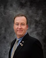 Mr. Landers A. Symes NU’87