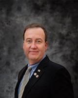 Mr. Landers A. Symes NU’87