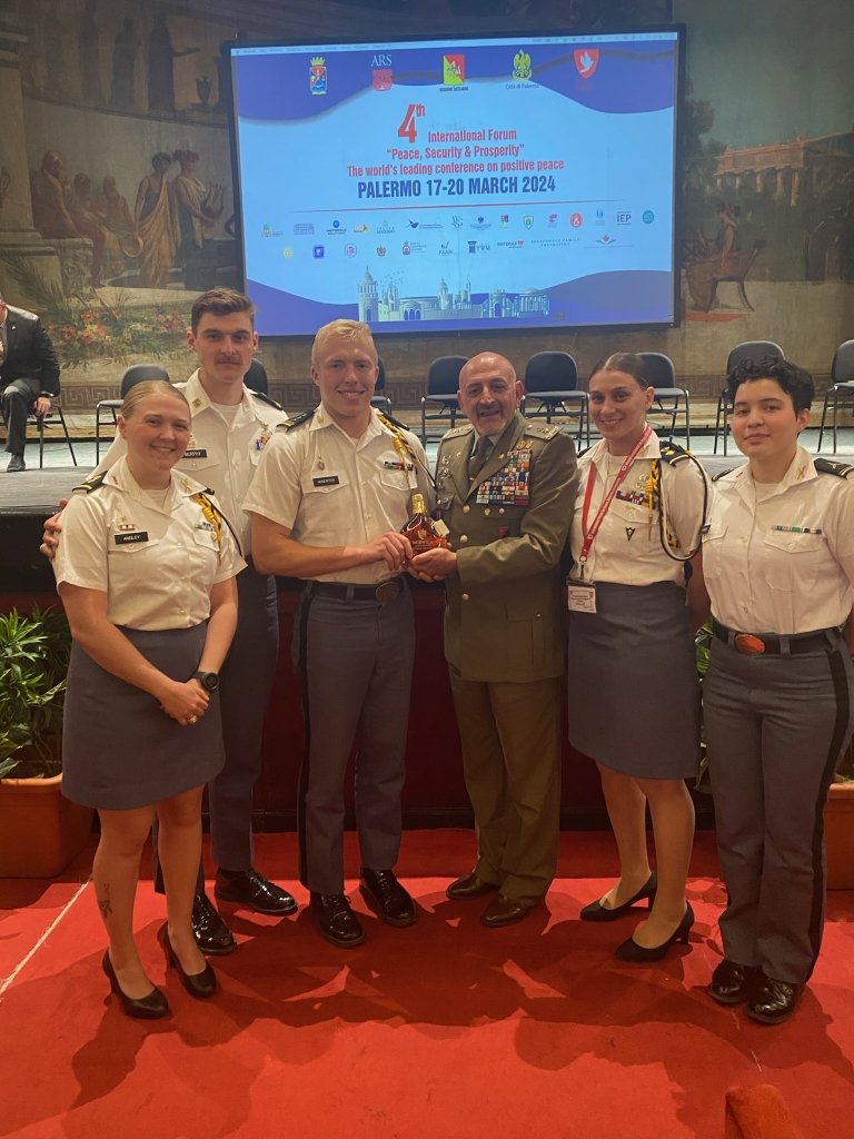 Norwich Cadets gift Major General Maurizio Angelo Scardino a bottle of Vermont Maple syrup. 