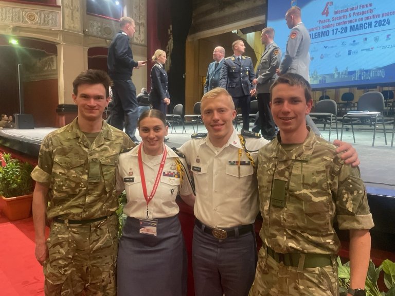  Logan Wineriter and Antonia Adipietro standing with two British Cadets.  