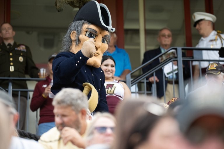 The Norwich mascot interacts with fans in the stands of Sabine Field.