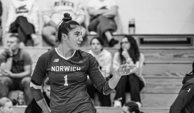Black and white photo of a Cadet volleyball player on the court.