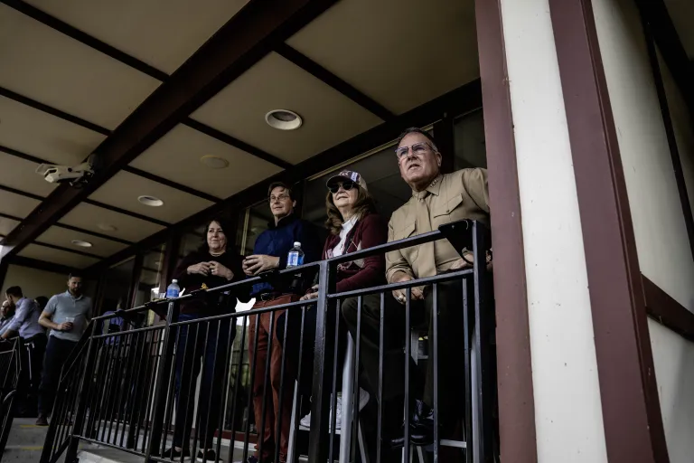 President Broadmeadow and First Lady Broadmeadow enjoy a game from the President's Box among supporters.