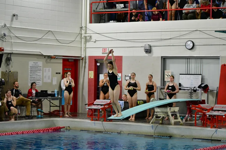 Ava LePage launches from the diving board.